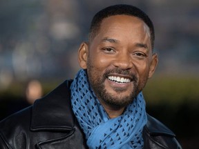 In this file photo taken on January 06, 2020 US actors Will Smith poses at the 'Bad Boys For Life' launching photocall in Paris, in front of the Eiffel Tower.
