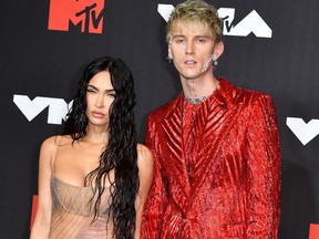 US actress Megan Fox (L) and US singer Machine Gun Kelly arrive for the 2021 MTV Video Music Awards at Barclays Center in Brooklyn, New York, September 12, 2021.