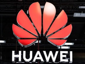 In this file photo taken on June 29, 2021, the Huawei logo is pictured at the Mobile World Congress (MWC) fair in Barcelona, Spain.