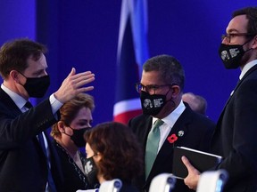 Britain's President for COP26 Alok Sharma, centre, looks on ahead of an informal stocktaking plenary during the COP26 UN Climate Change Conference in Glasgow on Nov. 13, 2021.
