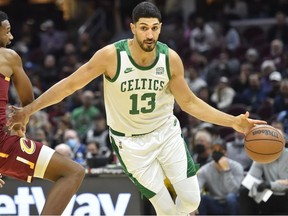 Boston Celtics center Enes Kanter drives against Cleveland Cavaliers center Evan Mobley in the third quarter at Rocket Mortgage FieldHouse.