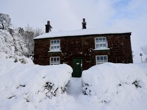A general view of a house that's covered in snow that fell overnight from Storm Arwen in Leek, Staffordshire, Britain, November 27, 2021.