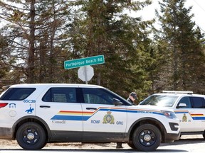 Royal Canadian Mounted Police (RCMP) block the entrance to Portapique Beach Road after they finished their search for Gabriel Wortman, who they describe as a shooter of multiple victims, in Portapique, N.S., April 19, 2020.