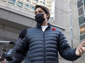 Canada's Prime Minister Justin Trudeau leaves a pharmacy after receiving his seasonal flu vaccine in Ottawa, Ontario, November 5, 2021.