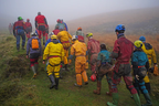 Rescuers walk Monday toward the Ogof Ffynnon Ddu cave system in Wales.  