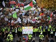 Demonstrators join the Fridays For Future march in Glasgow, Scotland, Friday, Nov. 5, 2021.