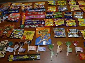 Edibles in illegal packaging, starkly similar to various well-known candy products, were seized when cops raided an unlicensed cannabis dispensary in North York Friday night.