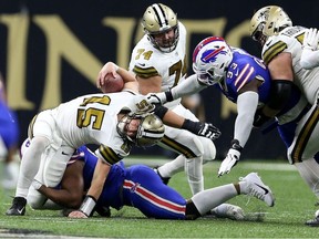 New Orleans Saints quarterback Trevor Siemian is sacked by Buffalo Bills defensive tackle Ed Oliver in the second quarter at the Caesars Superdome.