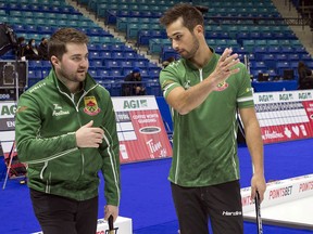 Matt Dunstone and Colton Lott at the Olympic Trials at SaskTel Centre in Saskatoon during a practice session on Friday.
