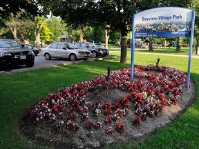 Bayview Village Park sign and garden bed.