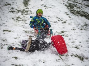Lincoln White, 6 (top) and Reid Milley, 6 enjoy some sledding by the R.C. Harris Water Treatment Plant in Toronto's Beaches neighbourhood on 
Nov. 29, 2021.