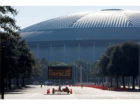 An electronic sign at the entrance to NRG Park states that the Astroworld Festival is cancelled, the morning after a deadly crush of fans during a performance by rapper Travis Scott in Houston, Nov. 6, 2021.