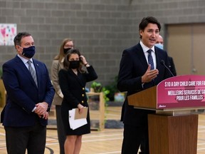 Prime Minister Justin Trudeau (right) speaks next to Alberta Premier Jason Kenney (left) on Nov. 15, 2021, during a joint federal-provincial announcement of $10-a-day daycare in Edmonton, Alta.