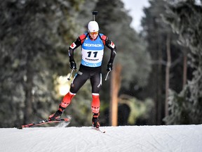 Scott Gow of Canada competes during the men's 10km sprint race at the IBU World Cup biathlon season opening at Ostersund Ski Stadium.