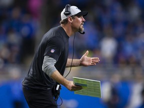 Detroit Lions head coach Dan Campbell gestures to a referee during the fourth quarter against the Chicago Bears.