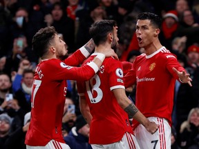 Manchester United's Cristiano Ronaldo celebrates scoring their second goal with teammates.
