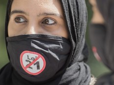 People protest against Bill 21 outside Quebec Premier Francois Legault's office in Montreal, June 14, 2020, on the one year anniversary of the controversial bill.