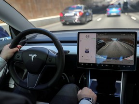 The interior of a Tesla Model 3 electric vehicle is shown in this picture illustration taken in Moscow, Russia July 23, 2020.