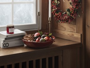 Hang a gorgeous wreath or position a large wooden fruit bowl, interspersed with glossy baubles, on a credenza or coffee table. SUPPLIED