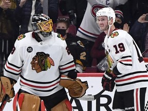 Chicago Blackhawks goalie Marc-Andre Fleury (left) and forward Jonathan Toews (right) celebrate the team's win against the Montreal Canadiens at the Bell Centre on Dec 9, 2021. The win was Fleury's 500th NHL victory.