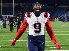 New England Patriots outside linebacker Matt Judon celebrates while leaving the field following his team's victory over the Buffalo Bills at Highmark Stadium on Dec. 6, 2021.