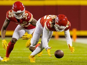 Kansas City Chiefs free safety Tyrann Mathieu (32) recovers a Pittsburgh Steelers fumble as cornerback Charvarius Ward (35) looks on during the second half at GEHA Field at Arrowhead Stadium on Dec. . Mandatory Credit: Jay Biggerstaff-USA TODAY Sports