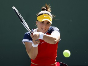 Bianca Andreescu of Canada returns a shot to Anett Kontaveit of Estonia during the BNP Paribas Open at the Indian Wells Tennis Garden on October 11, 2021 in Indian Wells, California.