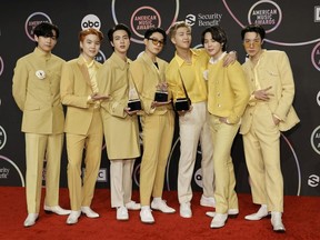 V, Suga, Jin, Jungkook, RM, Jimin, and J-Hope of BTS, winners of the Favorite Pop Song, Favorite Pop Duo or Group, and Artist of the Year awards, pose in the press room during the 2021 American Music Awards at Microsoft Theater on November 21, 2021 in Los Angeles, California.