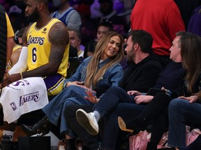 Jennifer Lopez and Ben Affleck watch the game between the Boston Celtics and the Los Angeles Lakers on Dec. 7, 2021.