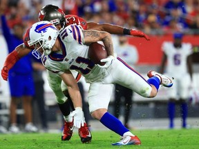 Cole Beasley of the Buffalo Bills runs with the ball after a reception against the Tampa Bay Buccaneers during the fourth quarter at Raymond James Stadium on December 12, 2021 in Tampa, Florida.