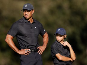 Tiger Woods and Charlie Woods look on during the Pro-Am ahead of the PNC Championship at the Ritz Carlton Golf Club Grande Lakes  in Orlando on Friday.