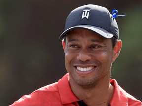 Tiger Woods smiles on the 12th hole during the final round of the PNC Championship on Sunday.