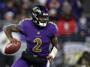 Quarterback Tyler Huntley #2 of the Baltimore Ravens drops back to pass against the Green Bay Packers at M&T Bank Stadium on December 19, 2021 in Baltimore, Maryland.