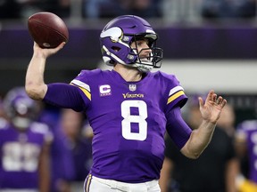 Kirk Cousins of the Minnesota Vikings throws a pass against the Los Angeles Rams in the fourth quarter at U.S. Bank Stadium on December 26, 2021 in Minneapolis, Minnesota.