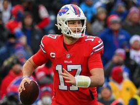 Buffalo Bills quarterback Josh Allen runs with the ball against the Carolina Panthers.