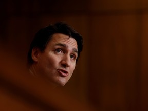 Prime Minister Justin Trudeau takes part in a news conference in Ottawa, Dec. 13, 2021.