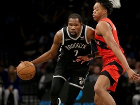 Nets forward Kevin Durant (7) controls the ball against Raptors forward Scottie Barnes (4) during the fourth quarter at Barclays Center.