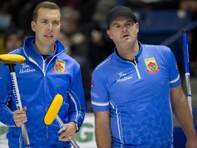 Brendan Bottcher, left, and Darren Moulding are pictured playing against Team Gushue at the Canadian curling trials on Nov. 20, 2021.