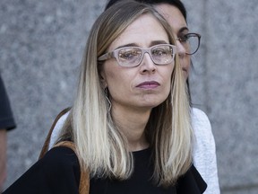 Annie Farmer, an alleged victim of Jeffrey Epstein, looks on as their lawyers speak to the press at federal court following a bail hearing for Jeffrey Epstein, July 15, 2019 in New York City.