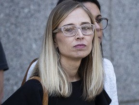 Annie Farmer, a victim of Jeffrey Epstein, looks on as their lawyers speak to the press at federal court following a bail hearing for Jeffrey Epstein, July 15, 2019 in New York City.