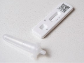 A COVID-19 Lateral Flow (LFT) self-test kit, containing a SARS-CoV-2 Antigen Rapid Test, supplied by Britain's National Health Service (NHS), is arranged for a photograph in Brenchley, south east England, on Dec. 14, 2021.