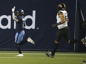 Argonauts Chris Edwards scores a pick-six touchdown late in the fourth quarter against the Ticats on Nov. 12 at BMO Field.