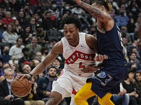 Toronto Raptors forward Scottie Barnes (left) drives to the net against Memphis forward Brandon Clarke during the game earlier this week.