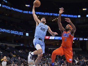 Memphis Grizzlies guard John Konchar (46) goes to the basket against Oklahoma City Thunder guard Paul Watson (8) during the second half at FedExForum Dec. 2, 2021.