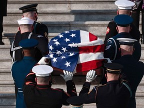 The casket of former U.S. senator Bob Dole arrives at the U.S. Capitol in Washington, D.C. where it will lie in state on Dec. 9, 2021.