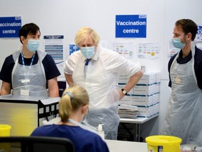 British Prime Minister Boris Johnson visits a National Health Service  COVID-19 vaccination centre near Ramsgate, England, Thursday, Dec. 16, 2021.