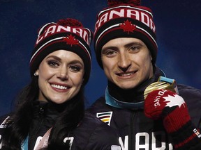 Gold medallists in the ice dance, Tessa Virtue and Scott Moir, of Canada, pose during their medals ceremony at the 2018 Winter Olympics in Pyeongchang, South Korea, Tuesday, Feb. 20, 2018.