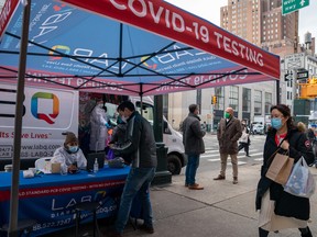 A person registers to have a COVID-19 test administered at a walk up testing site on December 15, 2021 in New York.