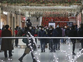 Last minute Christmas shopping at the Eaton Centre on Thursday. Jack Boland/Toronto Sun