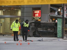 Toronto Police Traffic Services investigate a two-car collision that sent upwards of eight people to hospital that occurred in the intersection of Yonge and Richmond Sts. around 2 p.m.